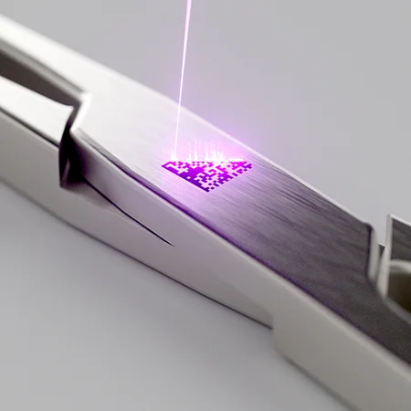 Black marking on stainless steel surgical scissors